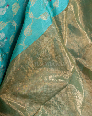 Chanderi Pattu saree in blue paired with a contrast pink brocade blouse