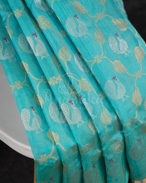 Chanderi Pattu saree in blue paired with a contrast pink brocade blouse