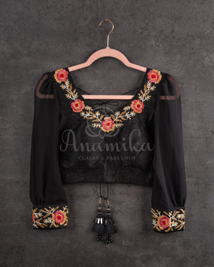 Stunning Black Crepe saree with bandini print and a gorgeous balloon sleeves blouse