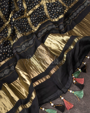 Stunning Black Crepe saree with bandini print and a gorgeous balloon sleeves blouse