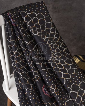 Stunning Black Crepe saree with bandini print and a gorgeous balloon sleeves blouse