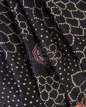 Stunning Black Crepe saree with bandini print and a gorgeous balloon sleeves blouse