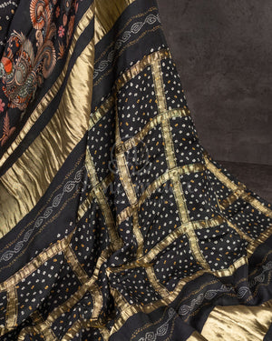 Stunning Black Crepe saree with bandini print and a gorgeous balloon sleeves blouse