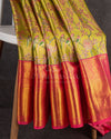 A tissue kanjeevaram saree in parrot green with pink border