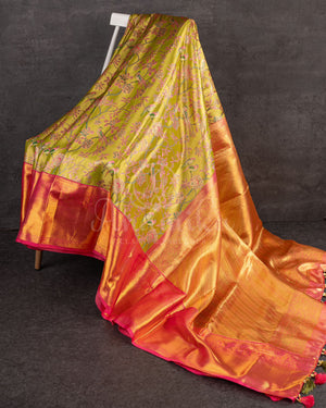 A tissue kanjeevaram saree in parrot green with pink border