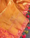 A tissue kanjeevaram saree in parrot green with pink border