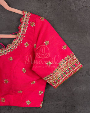 A tissue kanjeevaram saree in parrot green with pink border