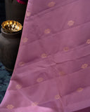 A beautifuk kanjeevaram saree in shades of mauve and purple