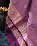 A beautifuk kanjeevaram saree in shades of mauve and purple