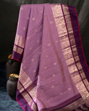 A beautifuk kanjeevaram saree in shades of mauve and purple
