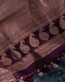 A beautifuk kanjeevaram saree in shades of mauve and purple