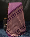 A beautifuk kanjeevaram saree in shades of mauve and purple