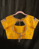 Organza silk saree in lavender with a contrast yellow handwork blouse