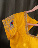Organza silk saree in lavender with a contrast yellow handwork blouse