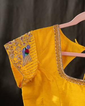 Organza silk saree in lavender with a contrast yellow handwork blouse