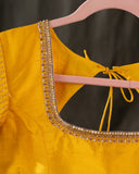 Organza silk saree in lavender with a contrast yellow handwork blouse