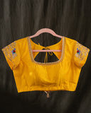 Organza silk saree in lavender with a contrast yellow handwork blouse