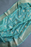 Handloom Mulcotton Saree in aqua blue paired with a designer patola blouse