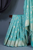 Handloom Mulcotton Saree in aqua blue paired with a designer patola blouse