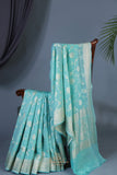 Handloom Mulcotton Saree in aqua blue paired with a designer patola blouse