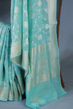 Handloom Mulcotton Saree in aqua blue paired with a designer patola blouse