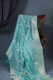 Handloom Mulcotton Saree in aqua blue paired with a designer patola blouse