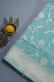 Handloom Mulcotton Saree in aqua blue paired with a designer patola blouse