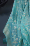 Handloom Mulcotton Saree in aqua blue paired with a designer patola blouse