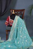 Handloom Mulcotton Saree in aqua blue paired with a designer patola blouse