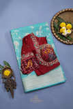 Handloom Mulcotton Saree in aqua blue paired with a designer patola blouse