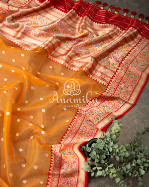Tangerine Orange Kora Banarasi saree with beautiful red handwork blouse