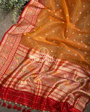 Tangerine Orange Kora Banarasi saree with beautiful red handwork blouse