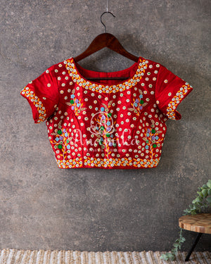 Tangerine Orange Kora Banarasi saree with beautiful red handwork blouse