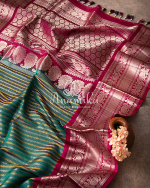 Dark Green Gadwal Pattu saree with a pink border