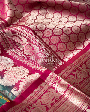 Dark Green Gadwal Pattu saree with a pink border