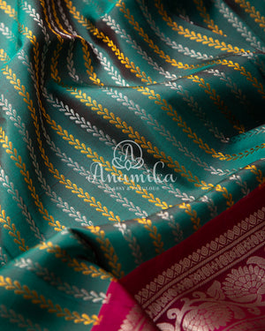 Dark Green Gadwal Pattu saree with a pink border