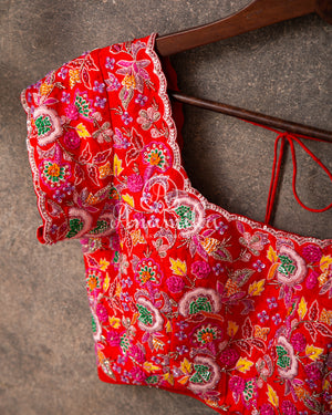 Lavender Georgette saree with handwork scallop border and a contrast red heavy work blouse