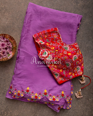Lavender Georgette saree with handwork scallop border and a contrast red heavy work blouse