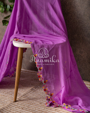 Lavender Georgette saree with handwork scallop border and a contrast red heavy work blouse