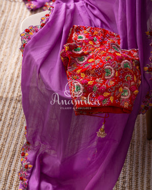 Lavender Georgette saree with handwork scallop border and a contrast red heavy work blouse