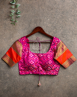 Orange Twill Ikkat saree with a beautiful kanchi border and pallu