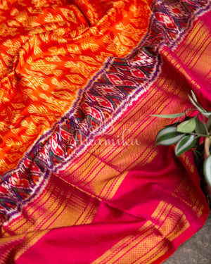 Orange Twill Ikkat saree with a beautiful kanchi border and pallu
