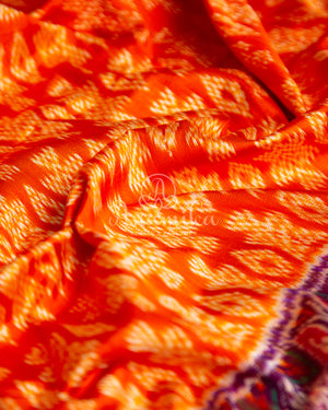 Orange Twill Ikkat saree with a beautiful kanchi border and pallu