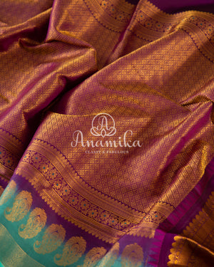 Teal Blue Gadwal Silk saree with contrast dark purple border