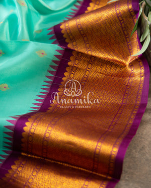 Teal Blue Gadwal Silk saree with contrast dark purple border