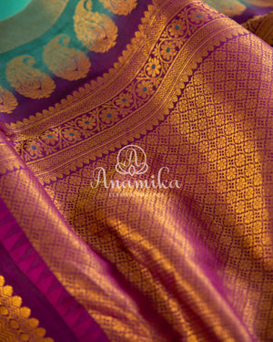 Teal Blue Gadwal Silk saree with contrast dark purple border