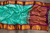 Teal Blue Gadwal Silk saree with contrast dark purple border