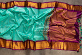 Teal Blue Gadwal Silk saree with contrast dark purple border