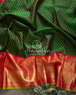 Green Kanchipattu saree with intricately designed work blouse