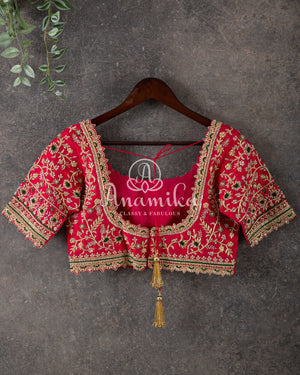 Green Kanchipattu saree with intricately designed work blouse